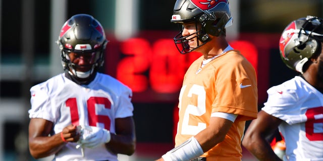 Tom Brady #12 of the Tampa Bay Buccaneers looks on during training camp at AdventHealth Training Center on July 26, 2021 in Tampa, Florida.