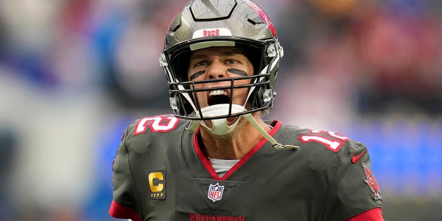 Tampa Bay Buccaneers quarterback Tom Brady (12) yells at Bucs fans as he takes the field for pregame warmups before playing the Los Angeles Rams Sep 26, 2021 in Inglewood, Calif.