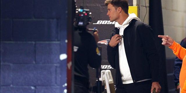 Tom Brady of the Tampa Bay Buccaneers walks to the locker room before a game against the New England Patriots at Gillette Stadium on October 03, 2021 in Foxborough, Massachusetts.