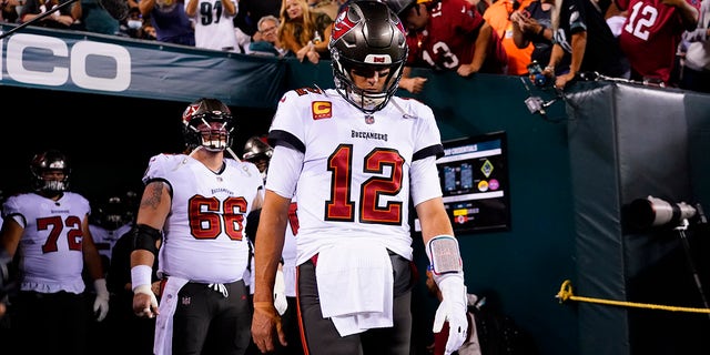 Tampa Bay Buccaneers quarterback Tom Brady (12) walks onto the field before an NFL football game against the Philadelphia Eagles on Thursday, Oct. 14, 2021, in Philadelphia.