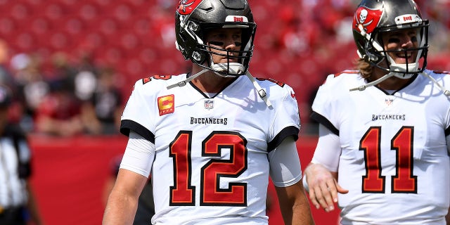 Sep 19, 2021; Tampa, Florida, USA; Tampa Bay Buccaneers quarterback Tom Brady (12) and Blaine Gabbert (11) warm up before the start of the game against the Atlanta Falcons at Raymond James Stadium.
