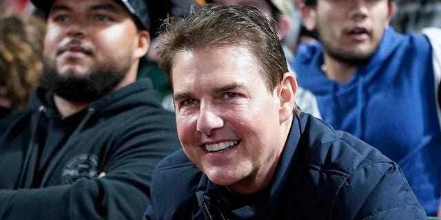 Actor Tom Cruise smiles during Game 2 of a baseball National League Division Series between the San Francisco Giants and the Los Angeles Dodgers Saturday, Oct. 9, 2021, in San Francisco.