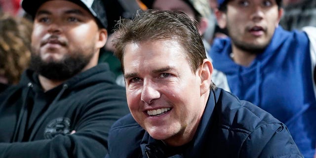 Actor Tom Cruise smiles during Game 2 of a baseball National League Division Series between the San Francisco Giants and the Los Angeles Dodgers Saturday, Oct. 9, 2021, in San Francisco.