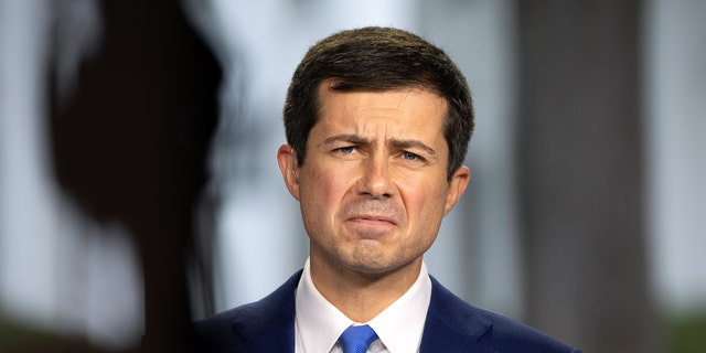 Transport Minister Pete Buttigieg is doing a television interview with CNBC outside the White House on October 13, 2021 in Washington, DC.  Buttigieg will be in Glasgow, Scotland for a climate summit despite a US supply chain crisis (Photo by Drew Angerer / Getty Images)