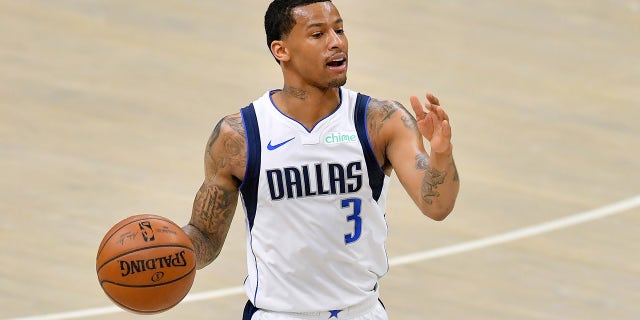CLEVELAND, OHIO - MAY 09: Trey Burke #3 of the Dallas Mavericks brings the ball up court during the second half against the Cleveland Cavaliers at Rocket Mortgage Fieldhouse on May 09, 2021 in Cleveland, Ohio. The Mavericks defeated the Cavaliers 124-97.