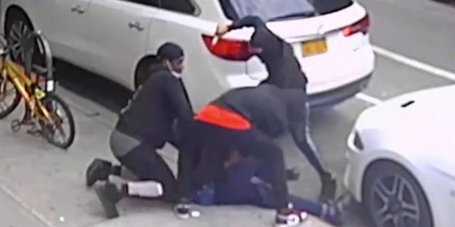 Photo of trio of assailants stabbing a victim, photo courtesy of the NYPD's DCPI.