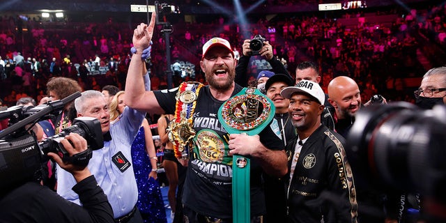 Tyson Fury of England celebrates after beating Deontay Wilder in a Heavyweight Championship boxing match on Saturday October 9, 2021 in Las Vegas.