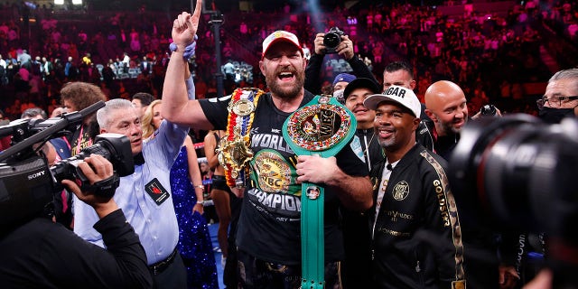 Tyson Fury of England celebrates after beating Deontay Wilder in a Heavyweight Championship boxing match on Saturday October 9, 2021 in Las Vegas.