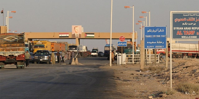 FILE - Cars wait in 2004 at a checkpoint at the Syrian-Iraqi border point of Al-Tanf, 270kms northeast of Damascus.  (Photo: LOUAI BESHARA/AFP via Getty Images)