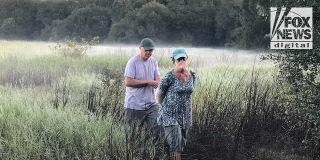 Chris and Roberta Laundrie are seen in the Myakkahatchee Creek Environmental Park in North Port, Florida, on the morning police discovered their son's skeletal remains.