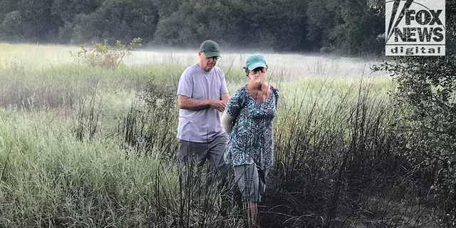 Chris and Roberta Laundrie are seen in the Myakkahatchee Creek Environmental Park in North Port, Florida, on the morning police discovered their son's skeletal remains.