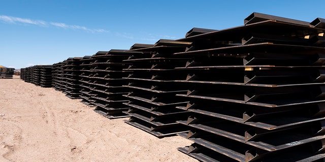 Piles of unused border fence sit at one of the construction staging areas on the Johnson Ranch near Columbus, New Mexico, on April 12, 2021.