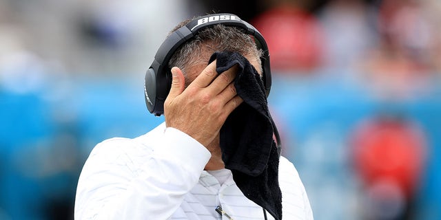 Head coach Urban Meyer of the Jacksonville Jaguars wipes his face with a towel during the game against the Denver Broncos at TIAA Bank Field on Sept. 19, 2021, in Jacksonville, Florida.