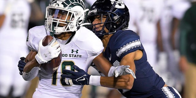 Colorado State wide receiver Thomas Pannunzio is tackled by Utah State's Jamie Nance during the second half of an NCAA college football game Friday, Oct. 22, 2021, in Logan, Utah.