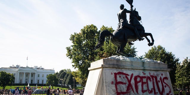 A statue of Andrew Jackson is pictured with graffiti on it saying "expect us" during the week of climate protests. (Photo by Karla Cote / SOPA Images/Sipa USA)No Use Germany.