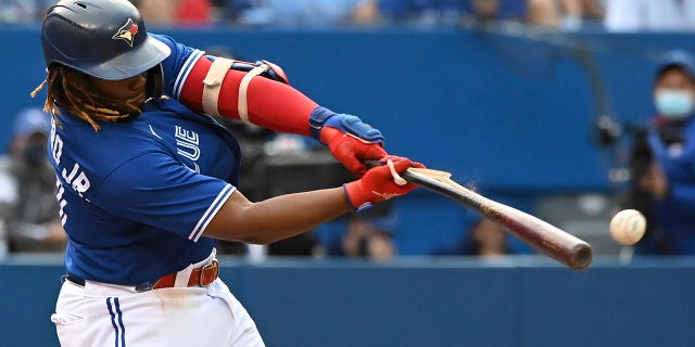 Toronto Blue Jays' Vladimir Guerrero Jr. hits a broken bat double in the sixth inning of a baseball game against the Baltimore Orioles in Toronto, Saturday, Oct. 2, 2021.