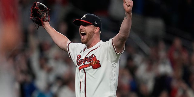 Atlanta Braves relief pitcher Will Smith celebrates after winning Game 6 of baseball's National League Championship Series against the Los Angeles Dodgers Sunday, Oct. 24, 2021, in Atlanta. The Braves defeated the Dodgers 4-2 to win the series.