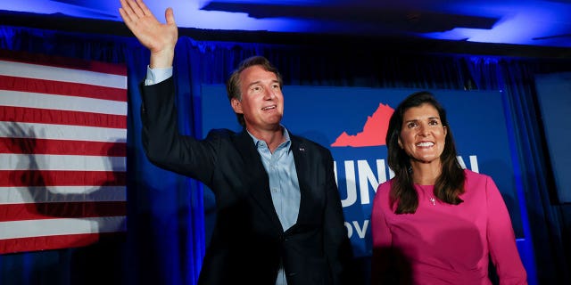 Virginia gubernatorial candidate Glenn Youngkin (R-VA), waves to the crowd at a campaign event with Nikki Haley, the former Governor of South Carolina and Ambassador to the UN, in McLean, Virginia, U.S., July 14, 2021. REUTERS/Evelyn Hockstein
