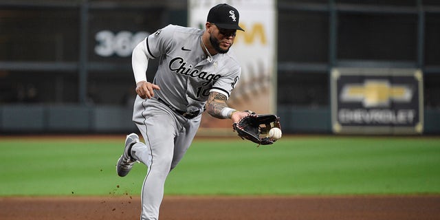 Chicago White Sox third baseman Yoán Moncada sends a ball to the ground by Houston Astros second baseman Jose Altuve in the third inning of Game 2 of a Divisional game. the American League on Friday, October 8, 2021, in Houston.  