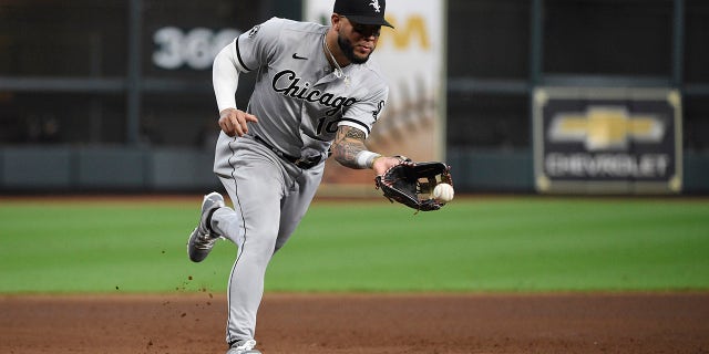 Chicago White Sox third baseman Yoán Moncada fields a ground ball by Houston Astros second baseman Jose Altuve during the third inning in Game 2 of an American League Division Series game Friday, Oct. 8, 2021, in Houston.  