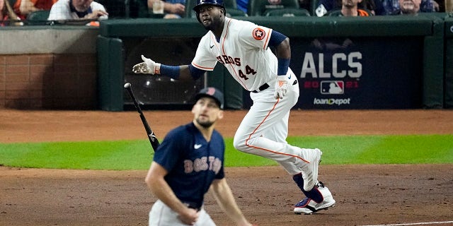 Houston Astros' Yordan Alvarez watches his RBI-double off Boston Red Sox starting pitcher Nathan Eovaldi during the first inning in Game 6 of baseball's American League Championship Series Friday, oct. 22, 2021, in Houston.