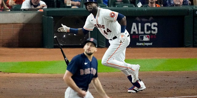 Houston Astros' Yordan Alvarez watches his RBI-double off Boston Red Sox starting pitcher Nathan Eovaldi during the first inning in Game 6 of baseball's American League Championship Series Friday, Oct. 22, 2021, in Houston.