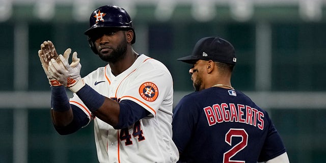 Houston Astros' Yordan Alvarez celebrates after s double against the Boston Red Sox during the fourth inning in Game 6 of baseball's American League Championship Series Friday, Oct. 22, 2021, in Houston.