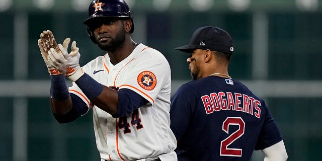 Houston Astros' Yordan Alvarez celebrates after s double against the Boston Red Sox during the fourth inning in Game 6 of baseball's American League Championship Series Friday, Oct. 22, 2021, in Houston.