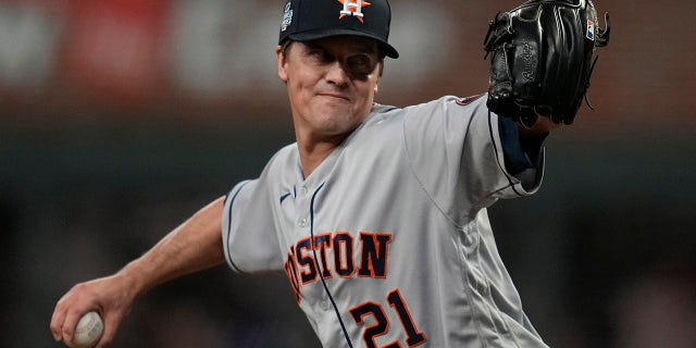 Houston Astros starting pitcher Zack Greinke throws during the first inning in Game 4 of baseball's World Series between the Houston Astros and the Atlanta Braves Saturday, Oct. 30, 2021, in Atlanta.