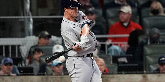 Houston Astros' Zack Greinke hits a single during the second inning in Game 4 of baseball's World Series between the Houston Astros and the Atlanta Braves Saturday, Oct. 30, 2021, in Atlanta.