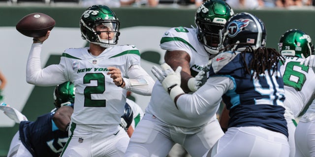 Oct 3, 2021; East Rutherford, New Jersey, USA; New York Jets quarterback Zach Wilson (2) throws the ball against the Tennessee Titans during the first half at MetLife Stadium. Mandatory Credit: Vincent Carchietta-USA TODAY Sports