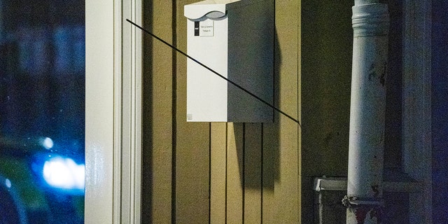 An arrow is seen in a wall after an attack in Kongsberg, Norway on Wednesday. 