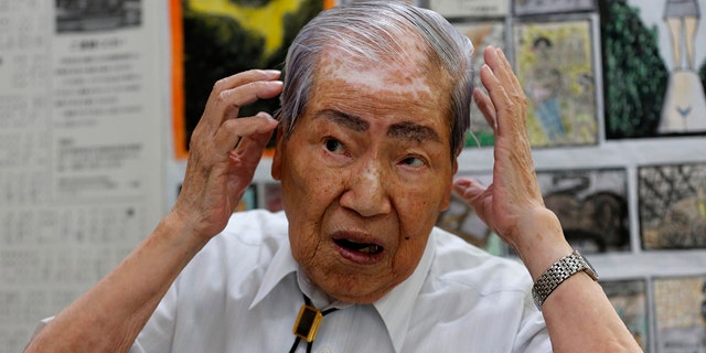 In this photo from August 2013, Sunao Tsuboi, then co-chairperson of Japan Confederation of A-and H-Bomb Sufferers Organizations, speaks during an interview at his office in Hiroshima, western Japan. 