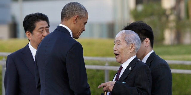In this photo from May 2016, Sunao Tsuboi, right, a survivor of the 1945 atomic bombing and chairman of the Hiroshima Prefectural Confederation of A-bomb Sufferers Organization, talks with President Obama, center, accompanied by Japanese Prime Minister Shinzo Abe, left, at Hiroshima Peace Memorial Park in Hiroshima, western Japan.