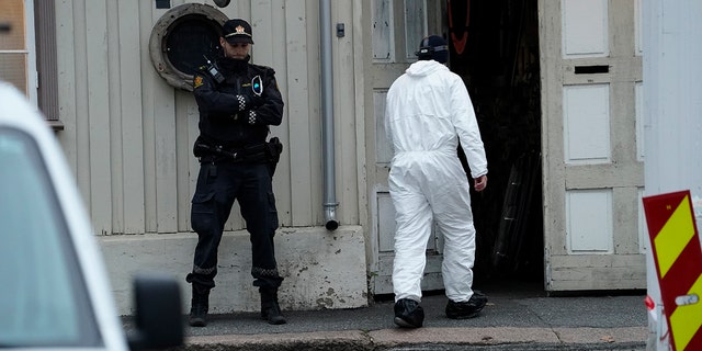 Police work near a site on Thursday after a man killed several people in Kongsberg, Norway.