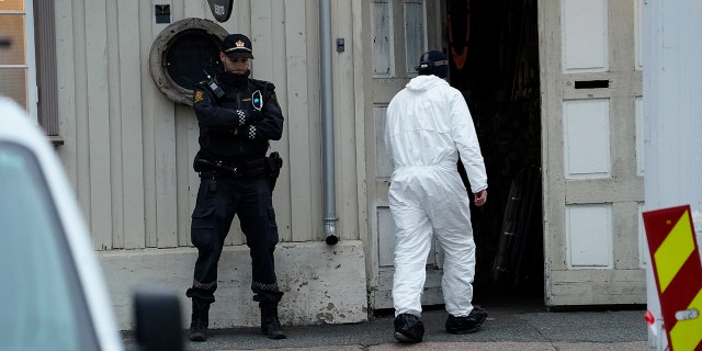 Police work near a site on Thursday after a man killed several people in Kongsberg, Norway.