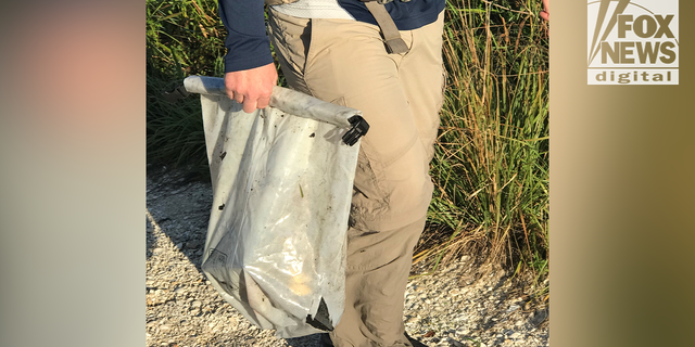 Images obtained exclusively by Fox News show Chris and Roberta Laundrie in the  Myakkahatchee Creek Environmental Park with at least one law enforcement officer on Wednesday