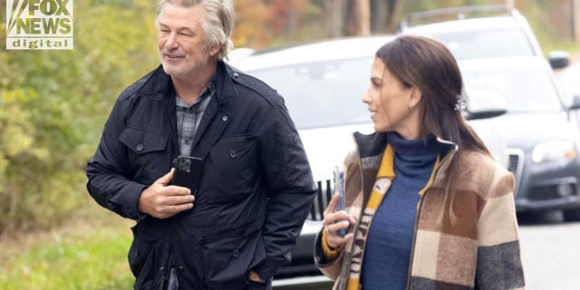 Baldwin and his wife Hilaria exited their car to speak to photographers.