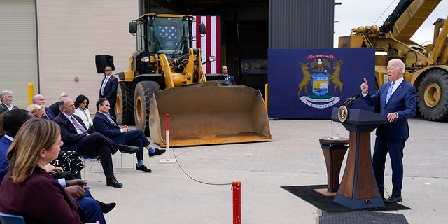 President Biden delivers remarks on his "Rebuild better" agenda during a visit to the International Union of Operating Engineers Local 324, Tuesday, October 5, 2021, in Howell, Michigan.  In the foreground on the left is US Rep.  Elissa Slotkin, D-Mich.
