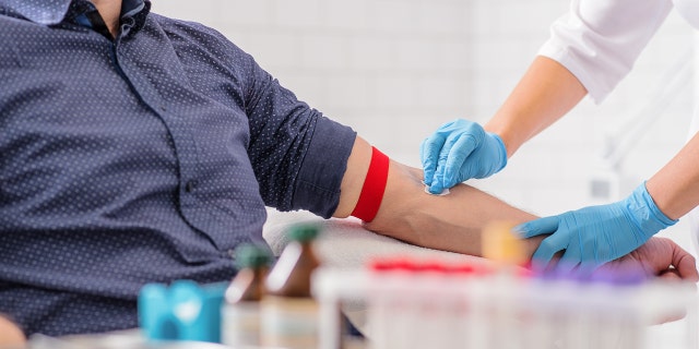 man donates blood