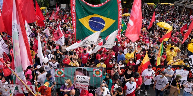 Demonstrators gather during a protest against Brazilian President Jair Bolsonaro, calling for his impeachment over his government's handling of the pandemic and allegations of corruption in the procurement of COVID-19 vaccines in Sao Paulo, Brazil, Saturday, October 10 .  2, 2021.