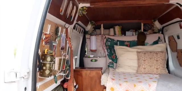 This screengrab from the Nomadic Statik YouTube video appears to show the same water bottle hanging on the left side of the van door.