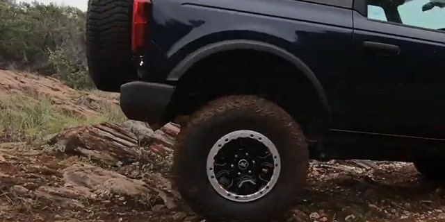 The Bronco's tail pipe does not extend beyond the bumper.