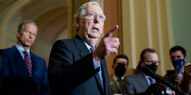 Senate Minority Leader Mitch McConnell speaks to reporters after a Republican strategy meeting at the Capitol, Oct. 19, 2021.