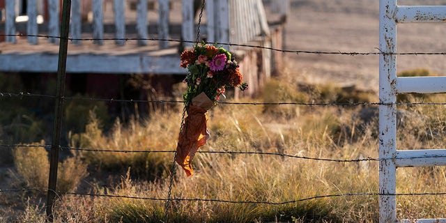 A bouquet of flowers is left to honor cinematographer Halyna Hutchins outside the Bonanza Creek Ranch in Santa Fe, N.M., Sunday, Oct. 24, 2021. 