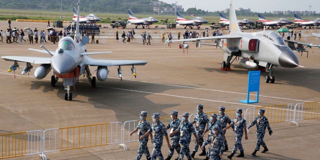 Chinese Air Force personnel march during 13th China International Aviation and Aerospace Exhibition on Sept. 29, 2021, in Zhuhai in China's Guangdong province. 