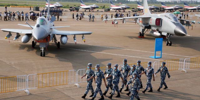 Chinese Air Force personnel march during 13th China International Aviation and Aerospace Exhibition on Sept. 29, 2021, in Zhuhai in China's Guangdong province. 