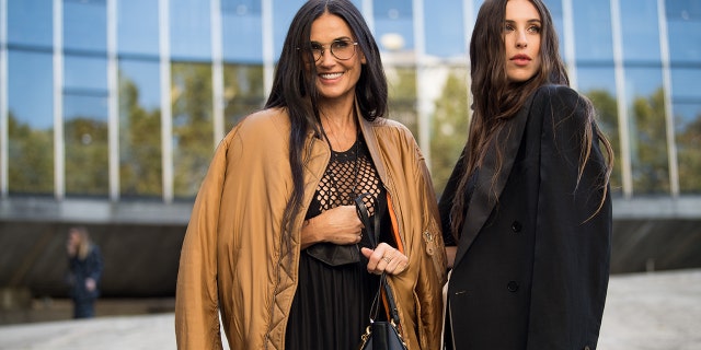 Demi Moore (L) and Scout Willis (R) attend attend the Stella McCartney Womenswear Spring/Summer 2022 show as part of Paris Fashion Week on October 04, 2021 in Paris, France.