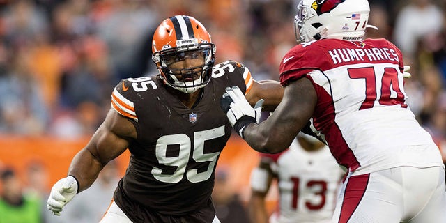 Oct 17, 2021; Cleveland, Ohio, USA; Cleveland Browns defensive end Myles Garrett (95) steps around a block by Arizona Cardinals offensive tackle D.J. Humphries (74) during the fourth quarter at FirstEnergy Stadium.