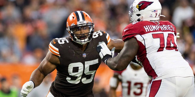 Oct 17, 2021; Cleveland, Ohio, USA; Cleveland Browns defensive end Myles Garrett (95) steps around a block by Arizona Cardinals offensive tackle D.J. Humphries (74) during the fourth quarter at FirstEnergy Stadium.